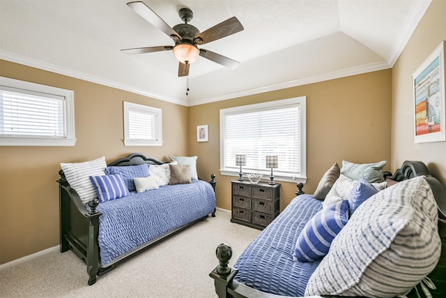 bedroom with vaulted ceiling, light colored carpet, ceiling fan, and crown molding