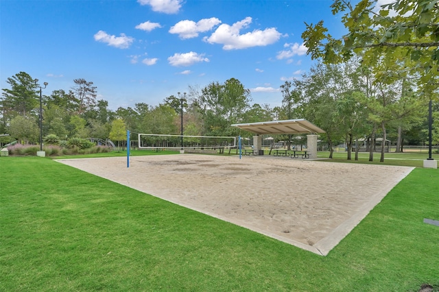 surrounding community featuring volleyball court and a yard