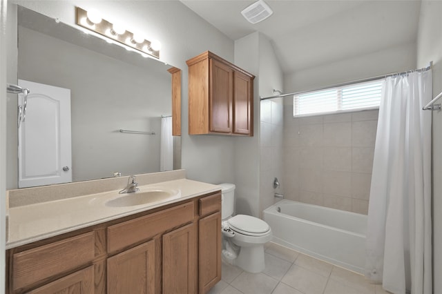 full bathroom with tile floors, toilet, shower / bath combo, and vanity with extensive cabinet space