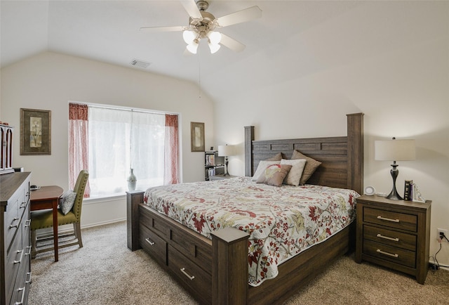 bedroom with a ceiling fan, visible vents, light carpet, and lofted ceiling