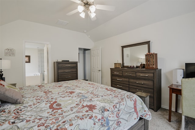 bedroom with ceiling fan, light colored carpet, ensuite bathroom, and vaulted ceiling