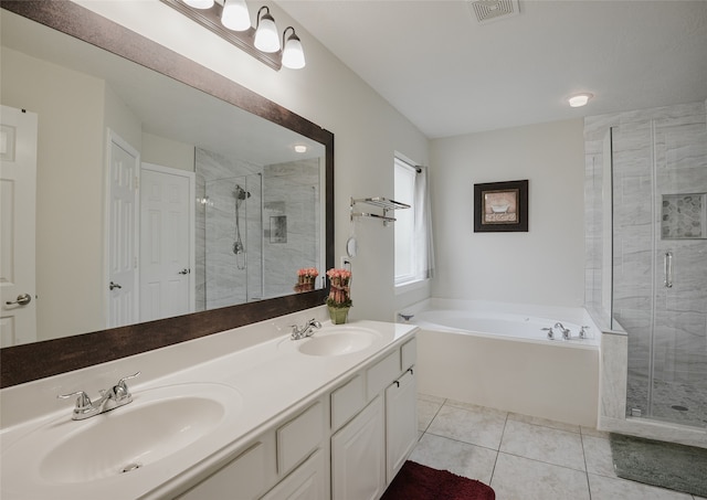 bathroom featuring tile patterned flooring, vanity, and shower with separate bathtub