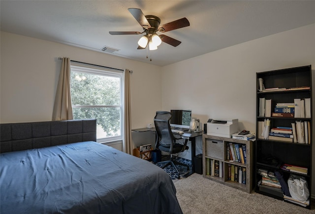 carpeted bedroom featuring visible vents and ceiling fan