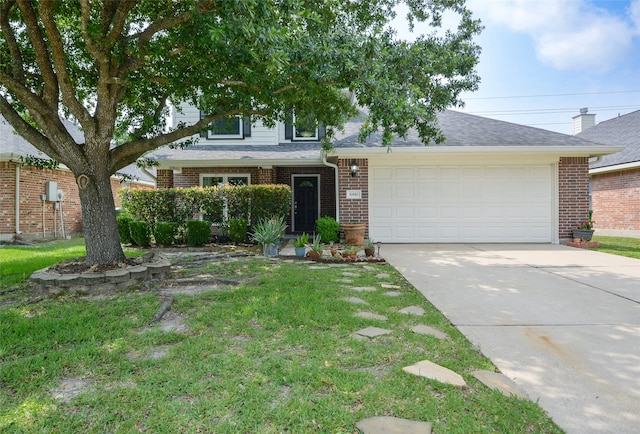 view of front of property with a garage and a front yard