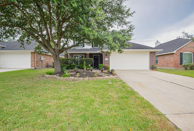 view of front of property featuring a garage and a front lawn