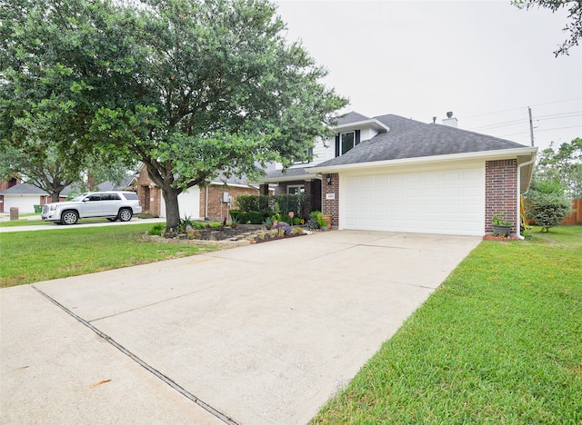 view of front of property featuring a garage and a front lawn