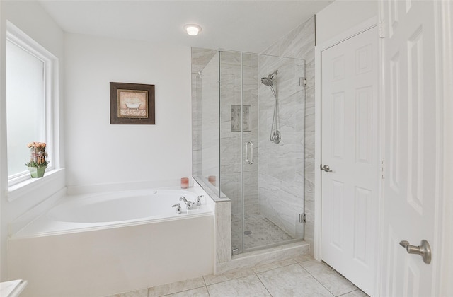 full bath with tile patterned flooring, a garden tub, and a stall shower