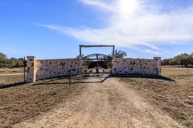 view of gate featuring fence