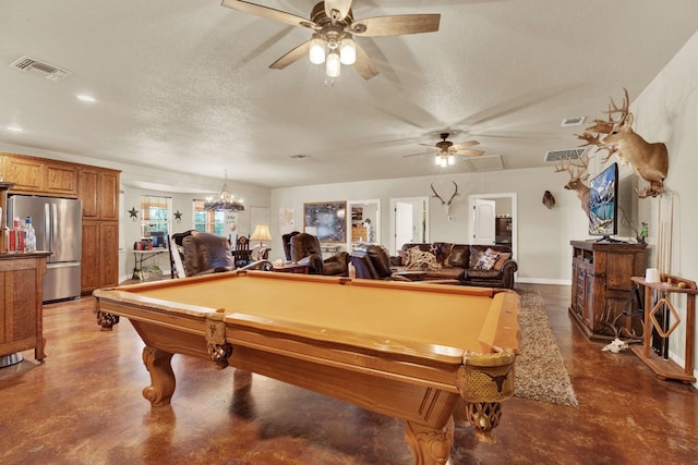 game room with concrete floors, billiards, and a textured ceiling