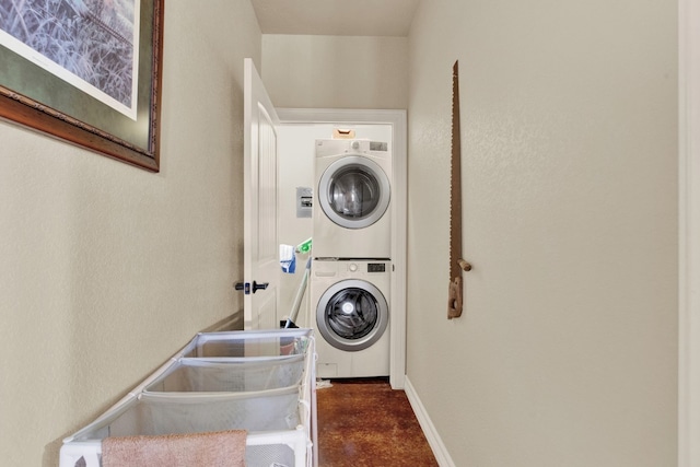 washroom with stacked washer / dryer