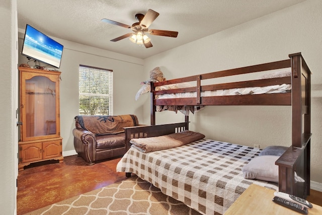 bedroom with concrete floors, a textured ceiling, and ceiling fan