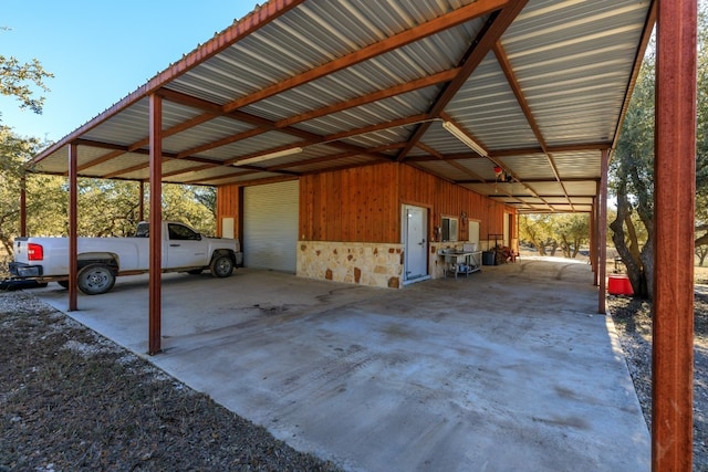 view of vehicle parking with a carport