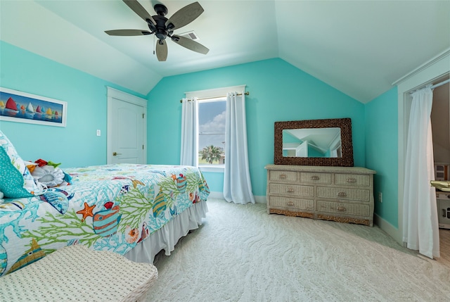 bedroom featuring carpet floors, ceiling fan, baseboards, and vaulted ceiling