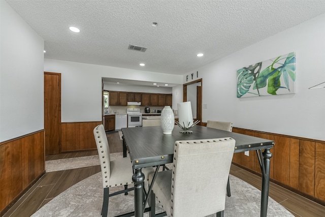 dining area featuring a textured ceiling