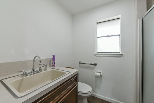 bathroom featuring toilet and vanity