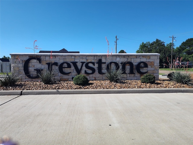 view of community sign