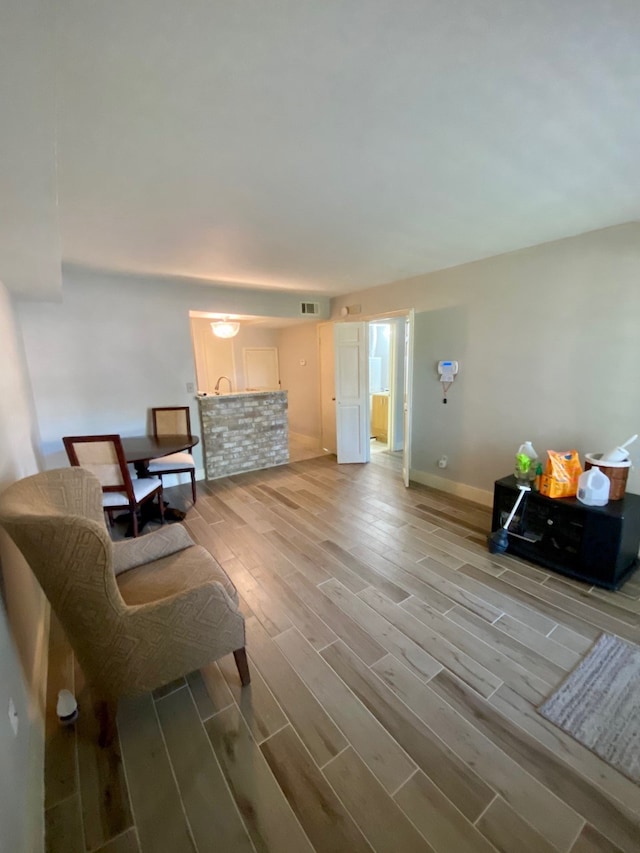 living area with hardwood / wood-style floors