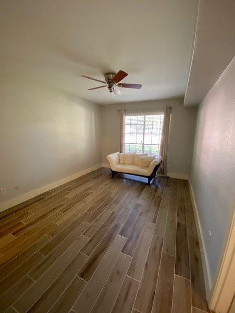 unfurnished room featuring dark hardwood / wood-style flooring and ceiling fan