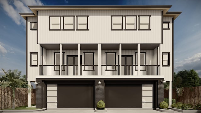 view of front facade featuring a balcony and a garage