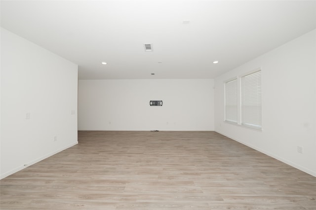 spare room featuring light hardwood / wood-style flooring