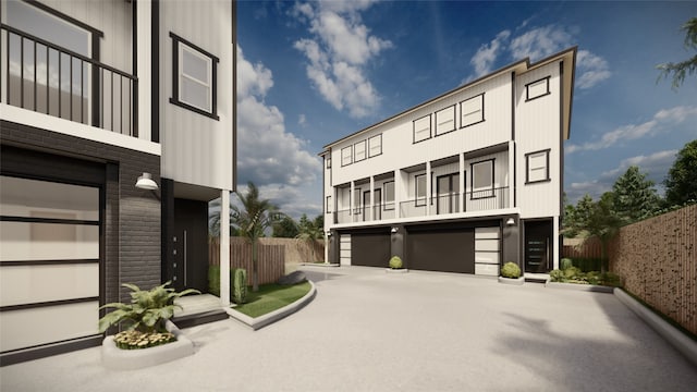 view of front of house featuring a garage and a balcony