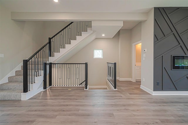 4748 Mallow St, Houston, TX 77033 - stairs with baseboards, beamed ceiling, wood finished floors, and recessed lighting