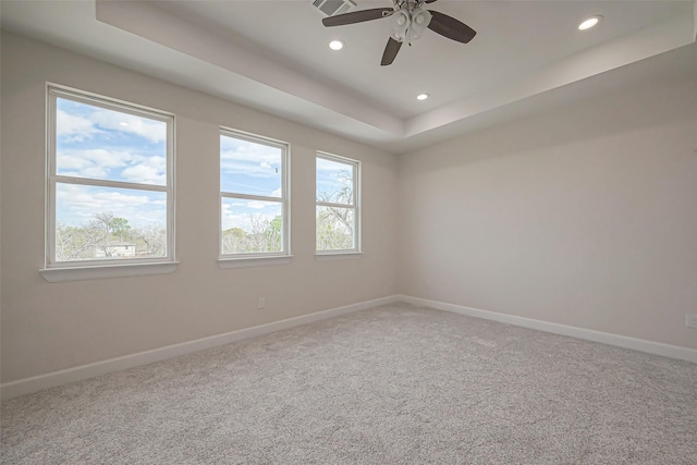 4748 Mallow St, Houston, TX 77033 - spare room featuring carpet flooring, a raised ceiling, a ceiling fan, baseboards, and recessed lighting