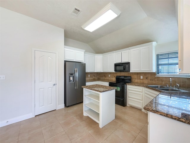 kitchen with black appliances, a kitchen island, white cabinets, and sink