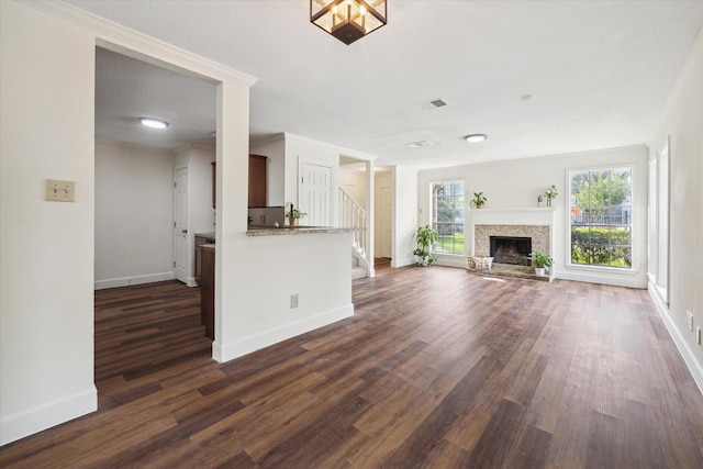 unfurnished living room featuring dark hardwood / wood-style flooring