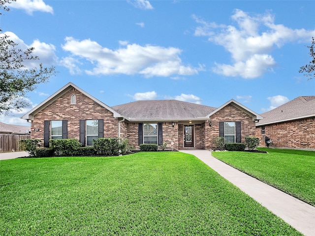 ranch-style home featuring a front yard