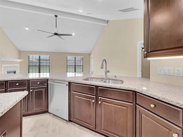 kitchen with dishwasher, a tile fireplace, sink, vaulted ceiling with beams, and ceiling fan