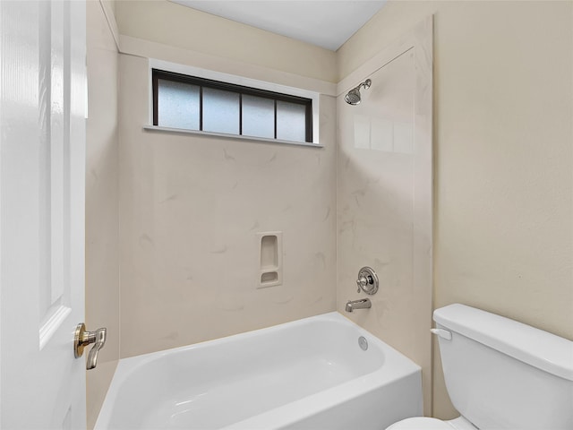 bathroom with shower / washtub combination and toilet