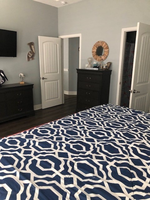 bedroom featuring dark hardwood / wood-style flooring