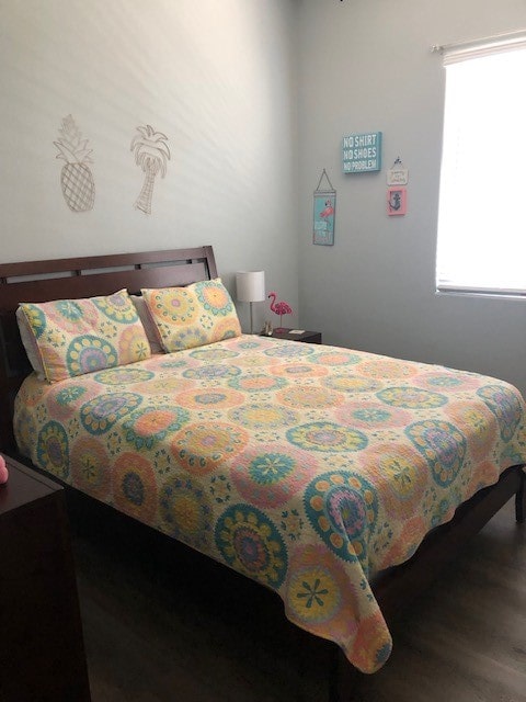 bedroom with wood-type flooring