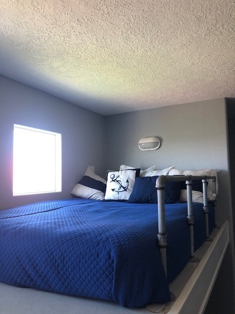 bedroom with a textured ceiling