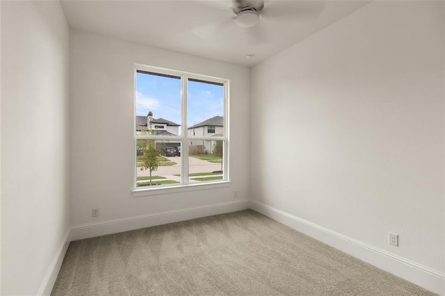 unfurnished room featuring carpet flooring and ceiling fan