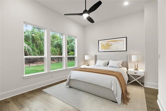 bedroom featuring hardwood / wood-style flooring and ceiling fan