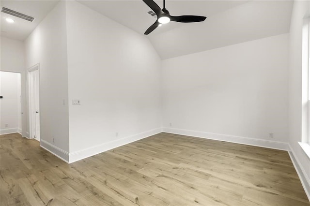 unfurnished room featuring vaulted ceiling, ceiling fan, and light hardwood / wood-style floors