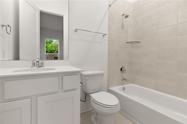 full bathroom with vanity, tiled shower / bath combo, and toilet