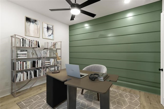 office featuring wood-type flooring and ceiling fan