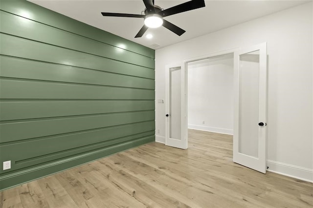 interior space featuring ceiling fan and light wood-type flooring