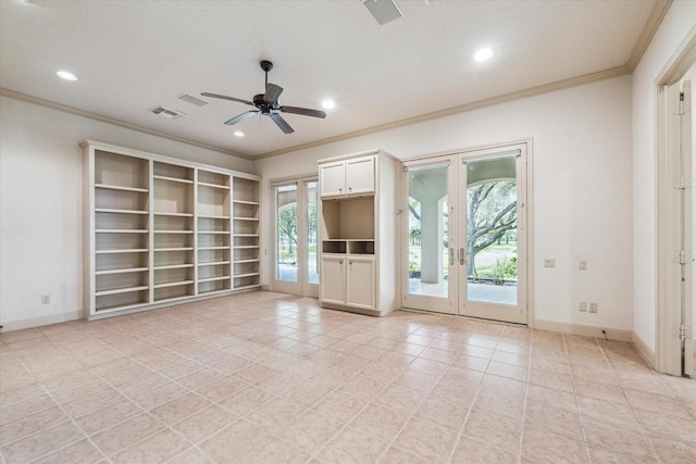 unfurnished living room featuring ornamental molding, plenty of natural light, built in features, and french doors