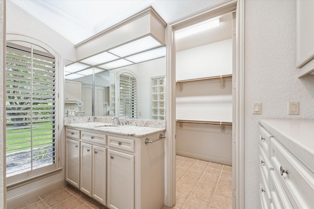 bathroom with vanity and tile patterned flooring