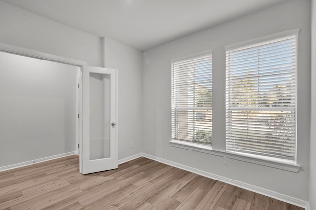 unfurnished room featuring light hardwood / wood-style floors