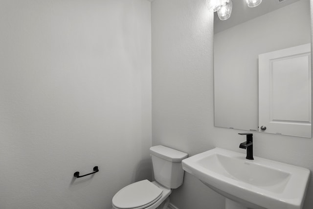 bathroom with toilet and sink