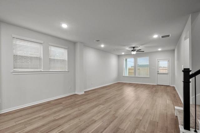 unfurnished room featuring ceiling fan and light hardwood / wood-style floors