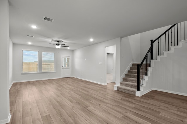 interior space with ceiling fan and light hardwood / wood-style flooring