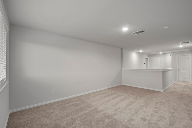 empty room with light colored carpet