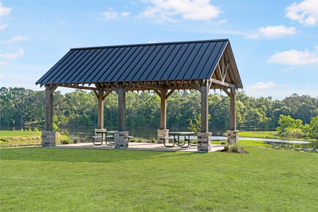 view of home's community with a lawn and a gazebo