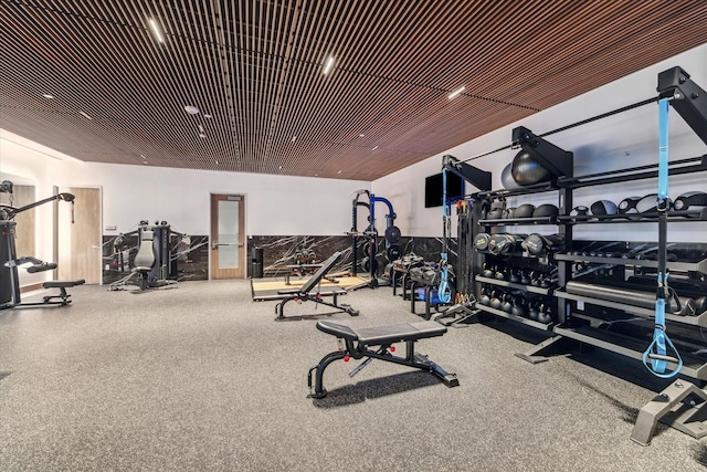 exercise room featuring wood ceiling